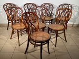 six chairs that are lined up in a row