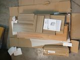 a pile of boxes and boxes that are on the floor