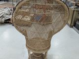 a wicker chair that is on display in a store