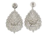 pair of silver earrings with white stones on a white background