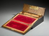 a small box with a red velvet lining inside of it