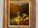 une peinture à l'huile représentant une nature morte composée de fruits et de fleurs, dans un cadre en bois