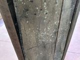 a close up of a wooden door with a metal handle