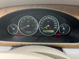 a close up of a car dashboard with various gauges