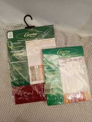two bags of food are sitting on a bed next to each other