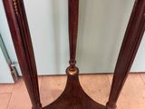 an image of a wooden table with a marble top and two legs