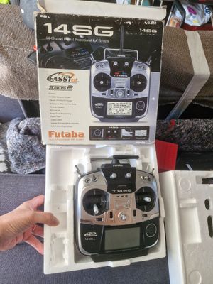 someone is holding a remote control in a box on a couch