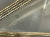 a close up of a piece of metal with a writing on it