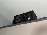 a speaker that is sitting on top of a shelf