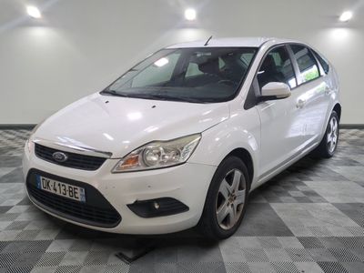 a picture of a white car parked in a garage