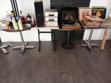 a table with a record player on it in front of a fireplace