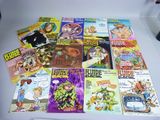 a lot of comic books on a white table
