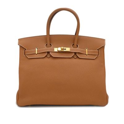 a brown leather handbag on a white background