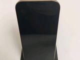 an image of a black cell phone on a stand