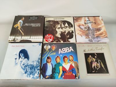 a lot of cds that are on a table