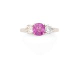 a pink sapphire and diamond three stone ring