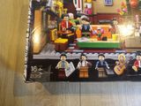 a box of legos on a table with a picture of people on it