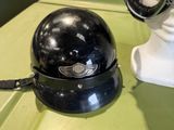 a helmet and goggles on display on a table