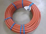 a close up of an orange hose with blue tape on it