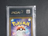 a close up of a pokemon card in a plastic case