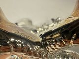 a person holding a silver object in their hand