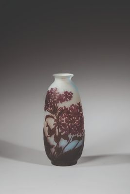 a vase that has a picture of a tree on it