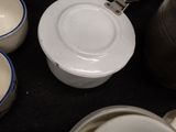 many bowls and cups that are on the table