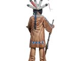 statue of a native american man with a rifle and a feathered headdress