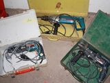 two tools in a case on the floor next to each other