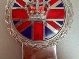 the badge of a british flag with a crown on top of it