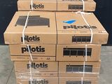 boxes stacked on top of each other in front of a black wall