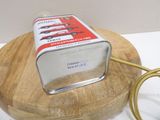 a can of food that is on a wooden stand