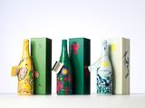 four different types of wine bottles lined up on a table