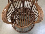 a wicker chair that is sitting on the floor