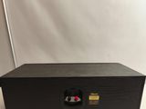 a close up of a speaker on a table with a white background