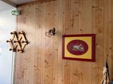 a picture of a wooden wall with a picture hanging on it