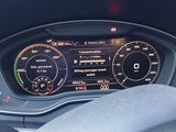 the dashboard of a car with a digital gauge and a steering wheel