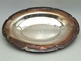 a silver plate that is sitting on a table