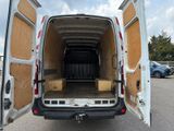 a white van with its doors open in a parking lot