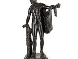 une image représentant une statue d'un homme tenant un chien