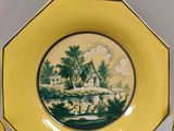three yellow plates with a picture of a man on a horse in a field