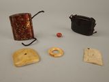 three items that are sitting on a white surface