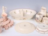 many different types of dishes and bowls on the table