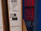 two boxes are stacked on top of each other on a shelf
