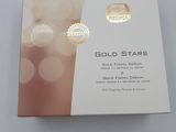 the box is open on a white surface with a gold star on it