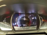 the dashboard of a car with a digital display on it