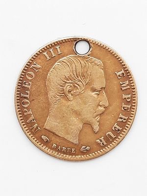 l'image d'une pièce d'or sur laquelle figure le visage d'un homme