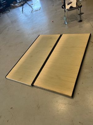 a large piece of wood laying on the floor in a room