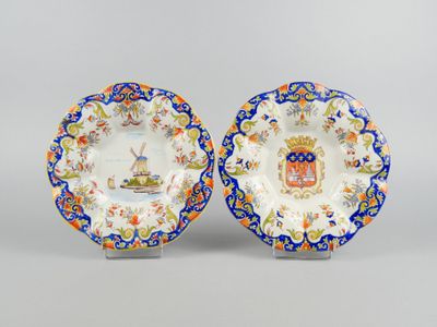 a pair of plates with a coat of arms on them