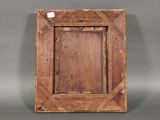 an old wooden picture frame on a gray background
